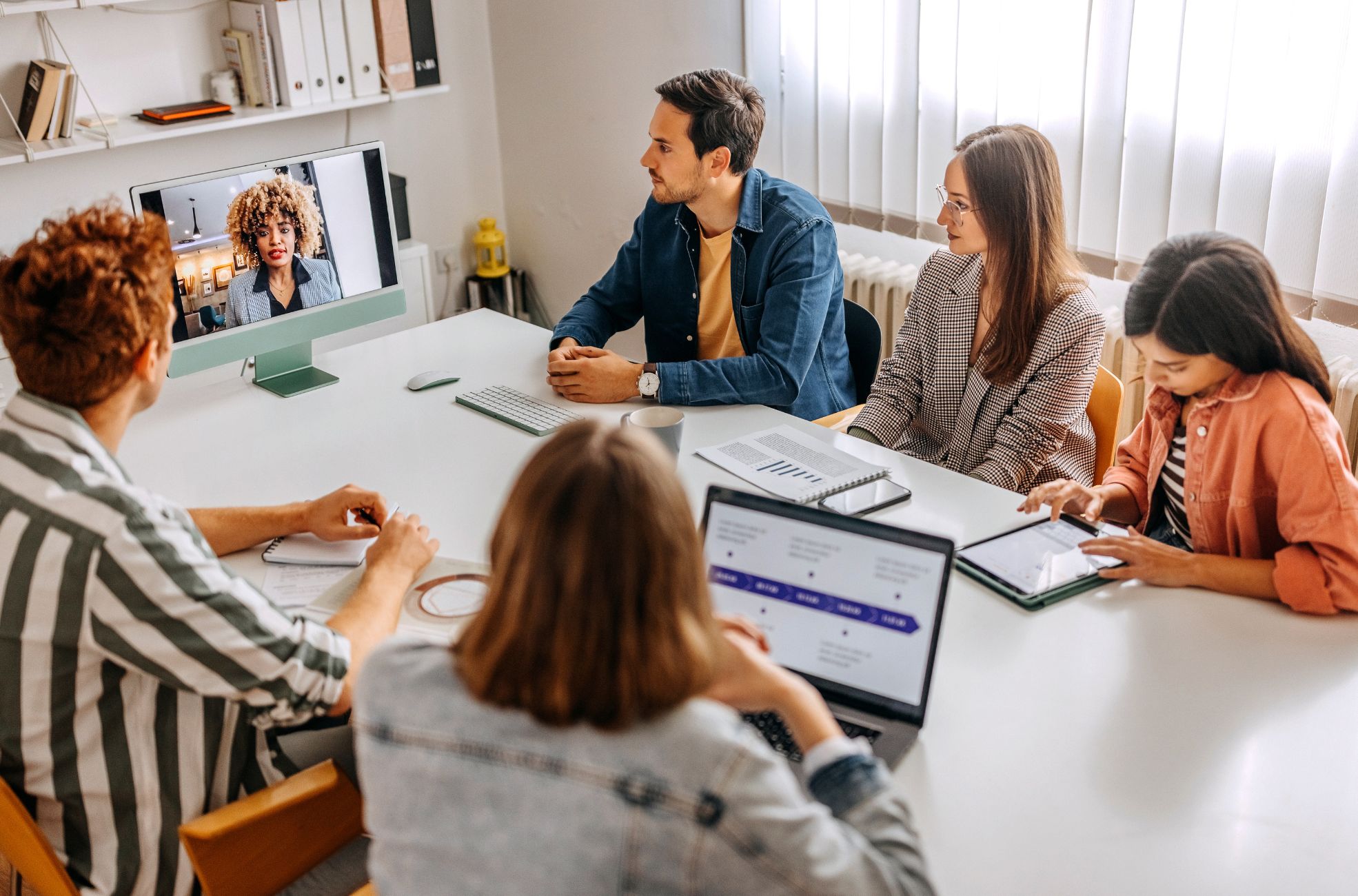 People Doing A Hybrid Meeting