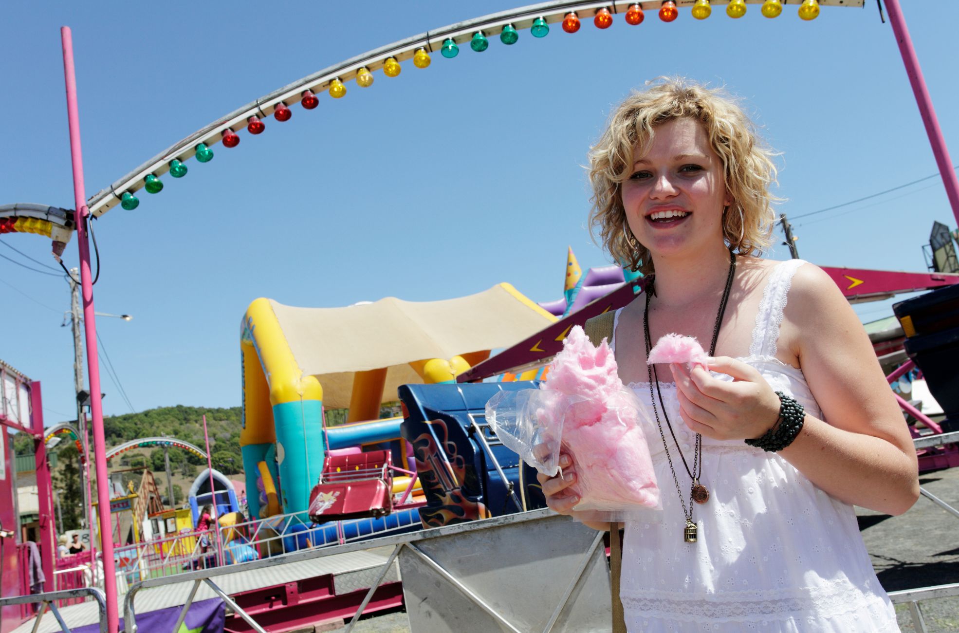 Woman Eating Fairy Floss At Carnival