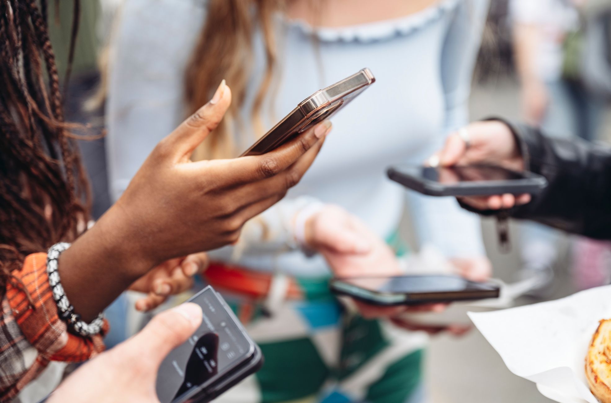 People Using Phones For Event Invites