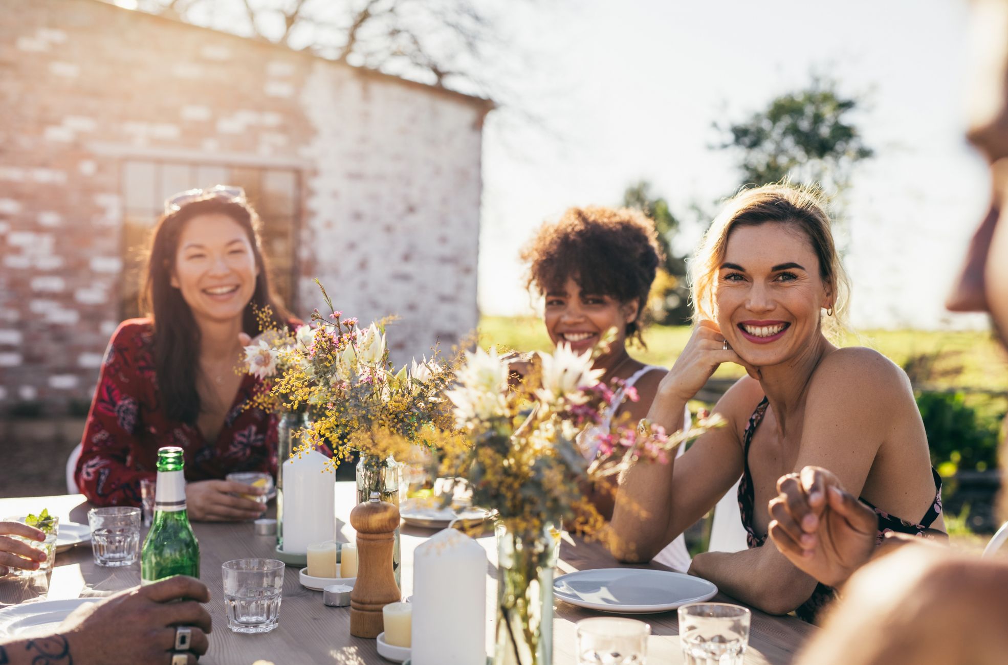 People Enjoying A Garden Party