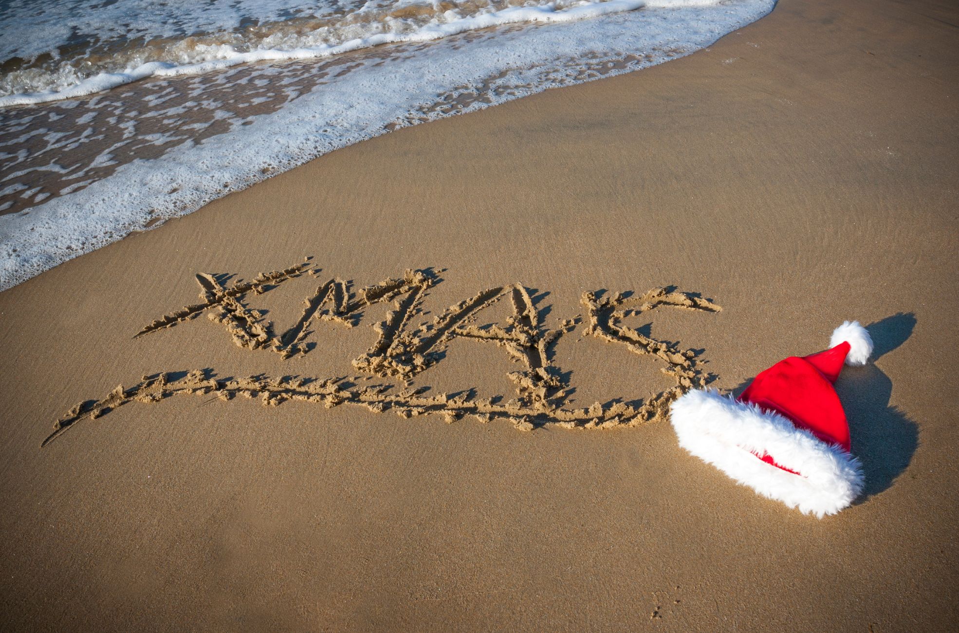 Christmas Hat On Coastal Sand