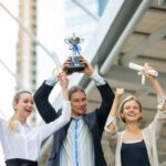 Corporate Team Members Holding Awards