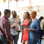 People of different ages, ethnicities and genders at an event collaboration between two local businesses