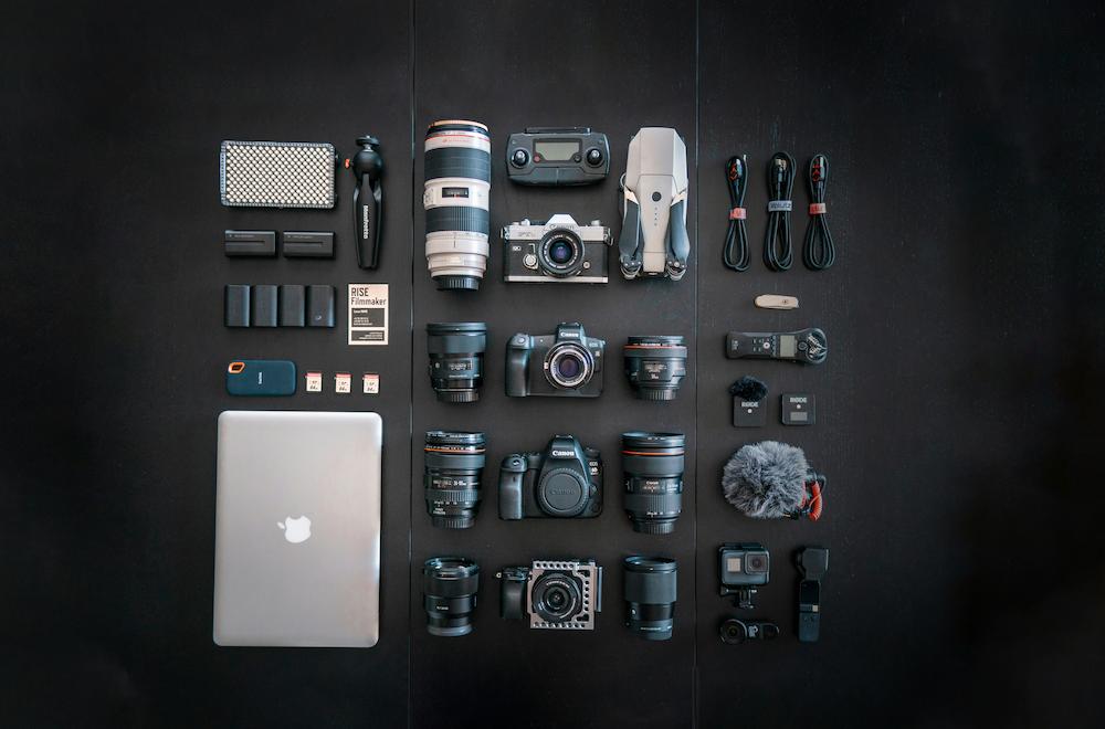 Flat lay of photography equipment needed for trying out creative event photography ideas