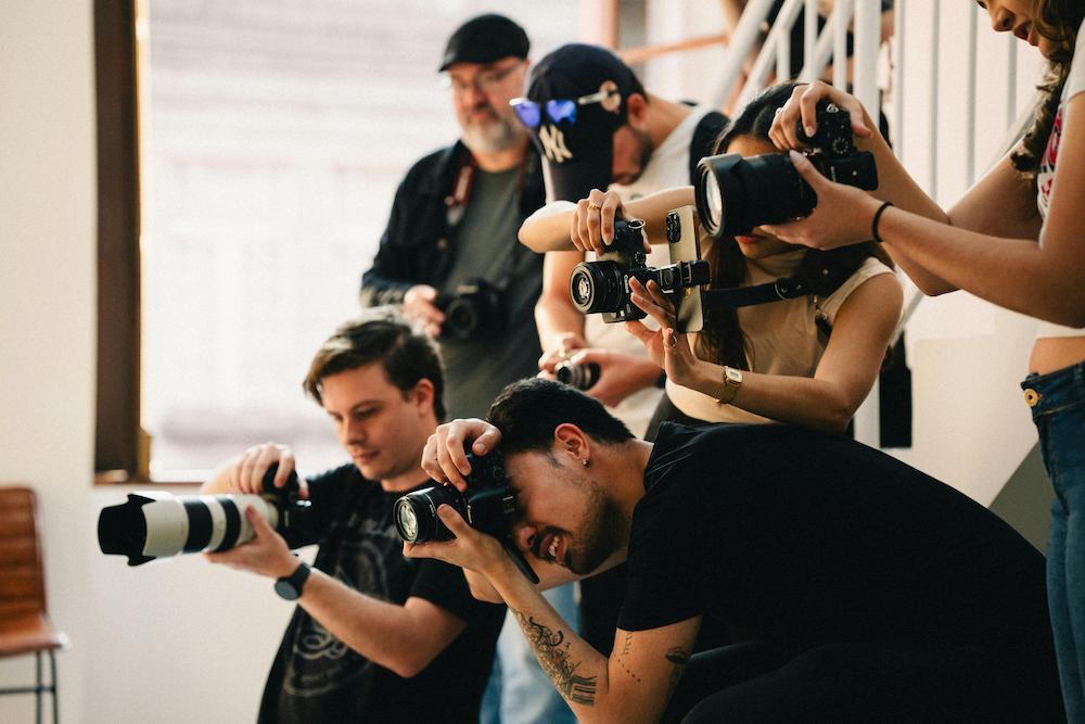 Group of photographers trying out event photography ideas