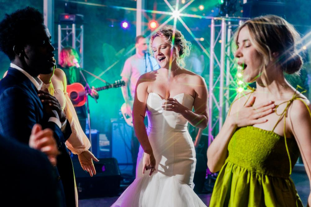 Bride and guests on the dance floor at a cocktail wedding reception