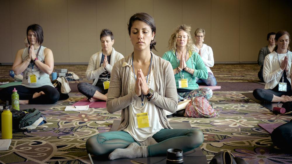 Group meditation as a wellness activity at a corporate event