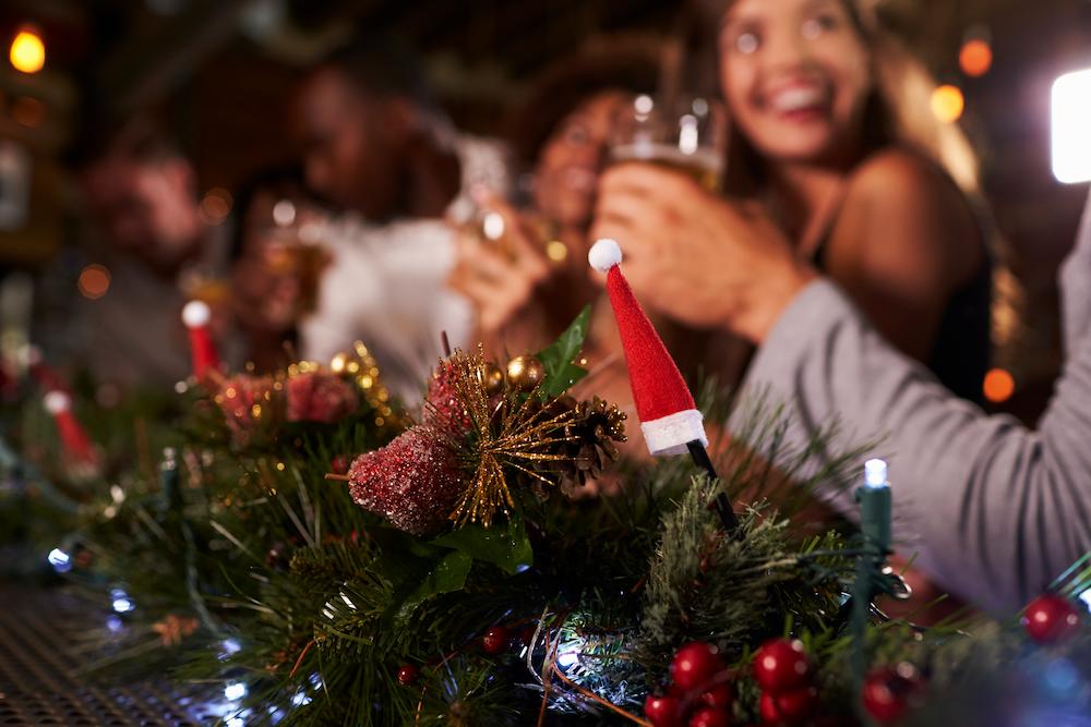 work Christmas party ideas in melbourne include using festive decorations such as these green and red table dressings to bring the vibe to the event