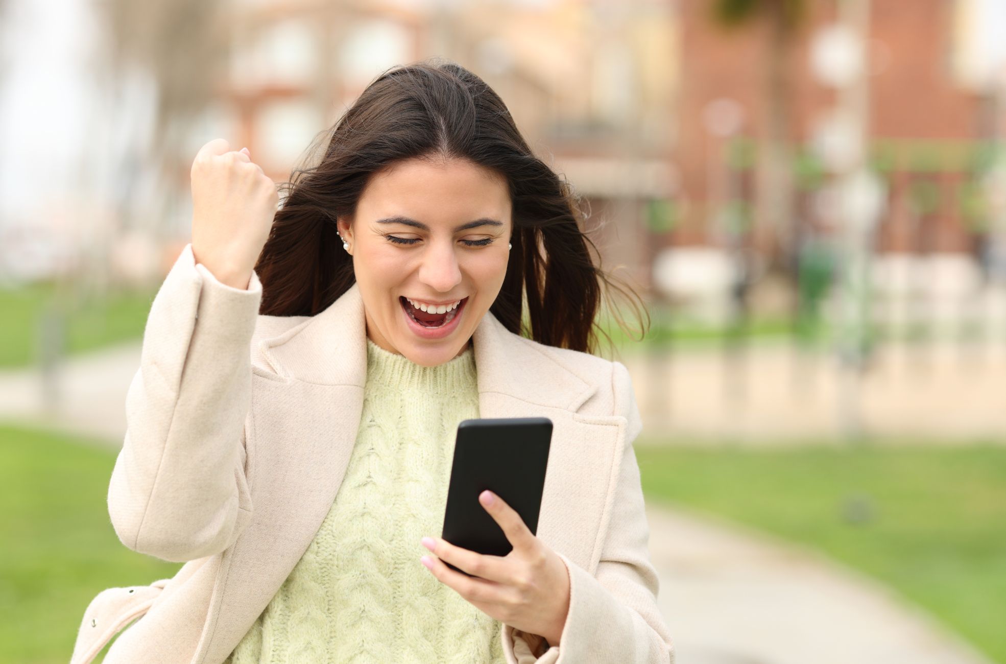 Person Excited Holding Phone