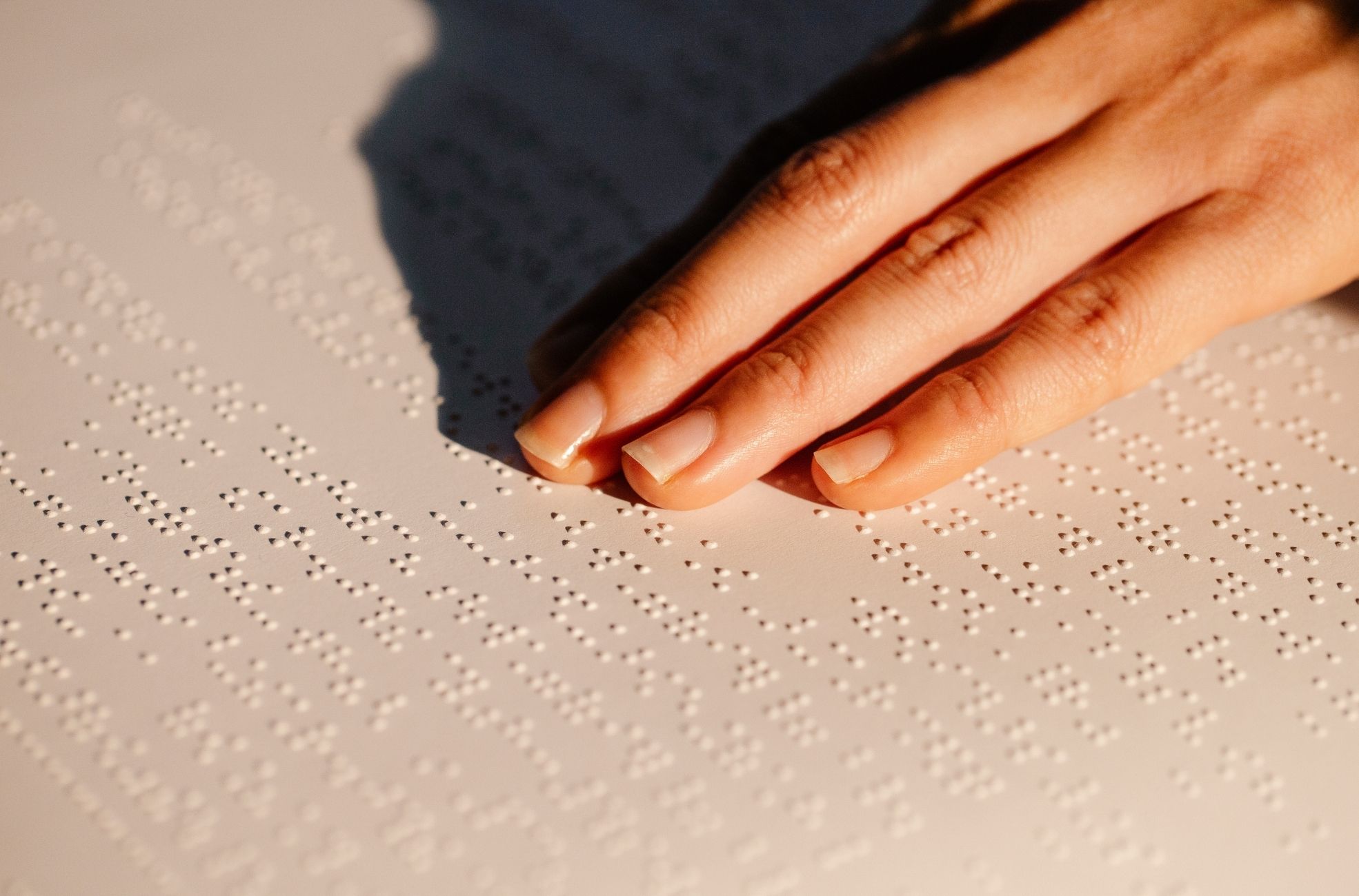 Female Hand Using Braille